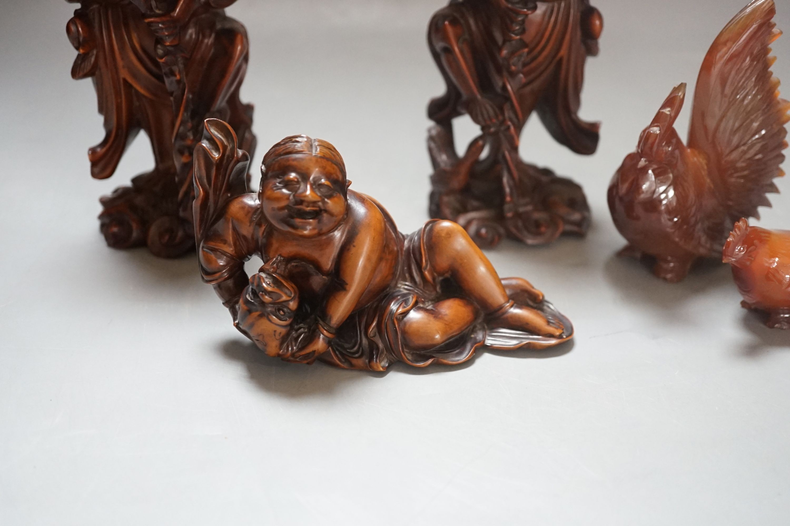 Three Chinese boxwood figures of two luohan, 18cm and Liu Hai and two hardstone chickens